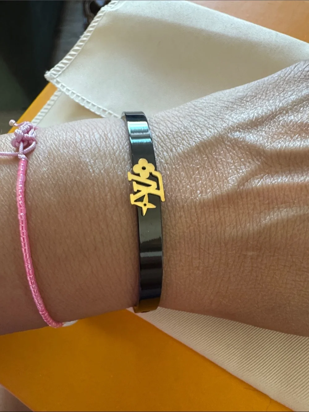 Louis Vuitton Black Bangle with Gold LV Motif